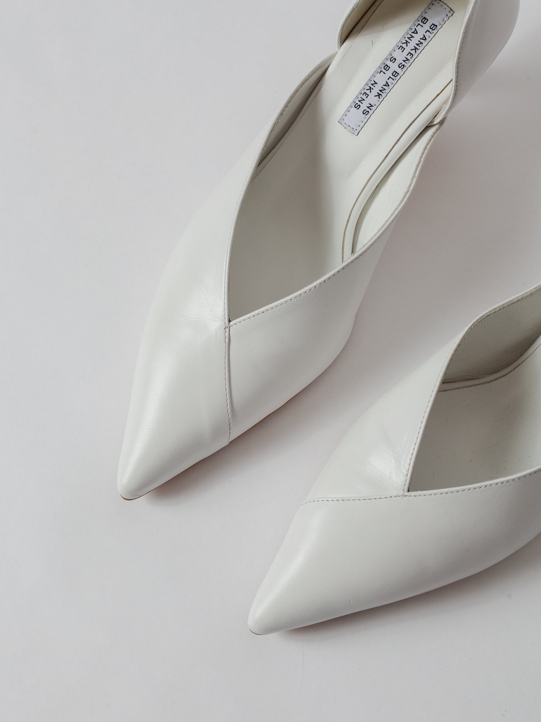 Blankens The Radford white White high-heeled shoes on a light gray background Weddings shoes White pointed-toe shoes on a light gray background